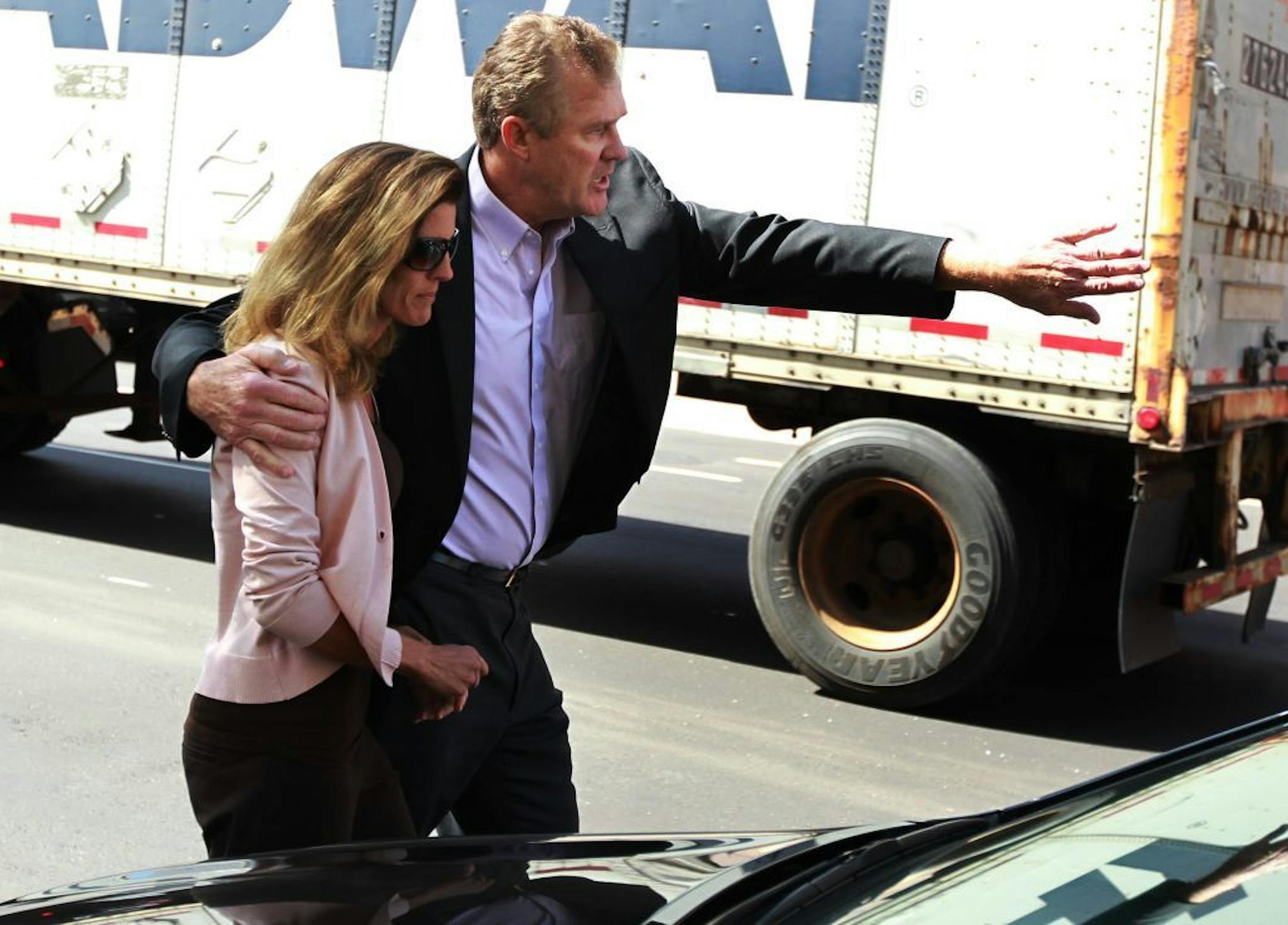 Joe Senser escorted his wife Amy Senser to a car after she was released from the Hennepin County Jail in downtown Minneapolis on Thursday.