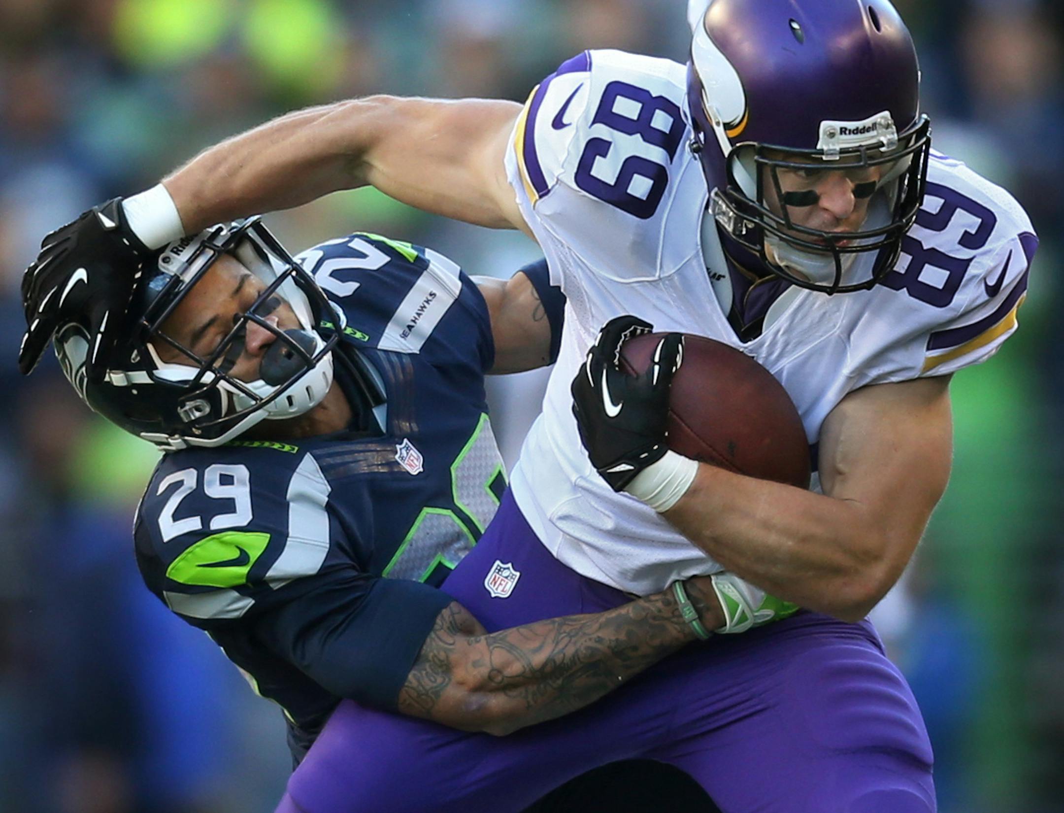 Seattle Seahawks free safety Earl Thomas (29) tackled Vikings tight end John Carlson (89).