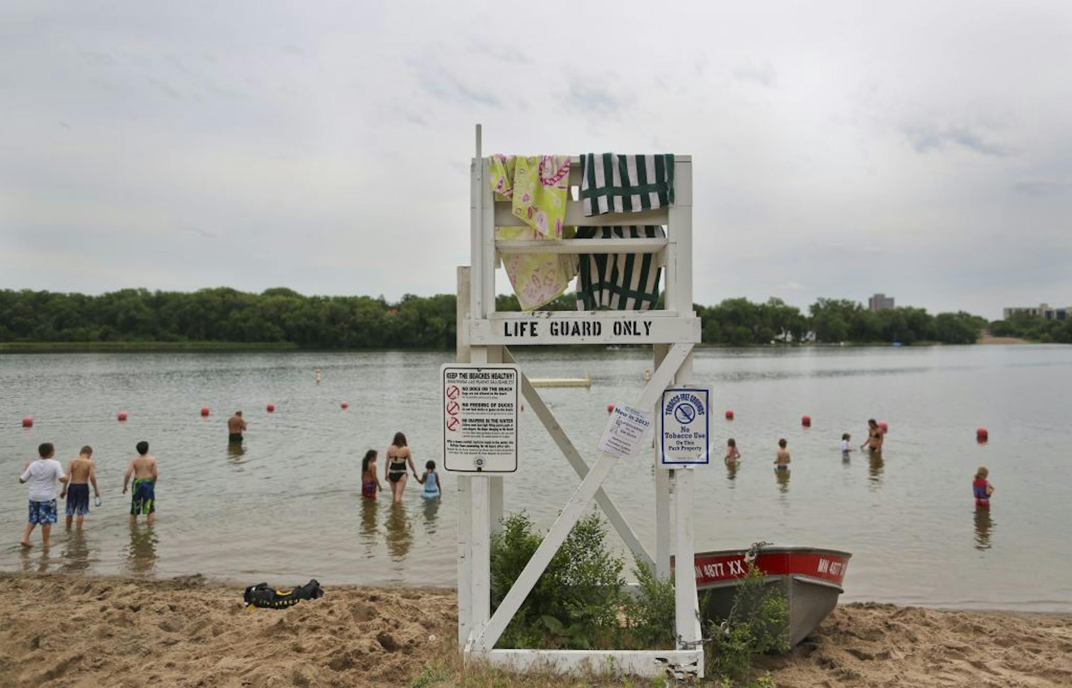 A life guard stand at a beach at Cedar Lake on Friday, June 15, in Minneapolis, Minn., remained without a lifeguard and was used by a couple girls as a place to dry their towels. On Sunday a 16-year-old girl drowned at this part of the lake.