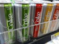 Cans of the Coca-Cola Co.&apos;s new flavored Diet Coke product in a supermarket in New York on Tuesday, February 13, 2018. The Coca-Cola Co. reports 