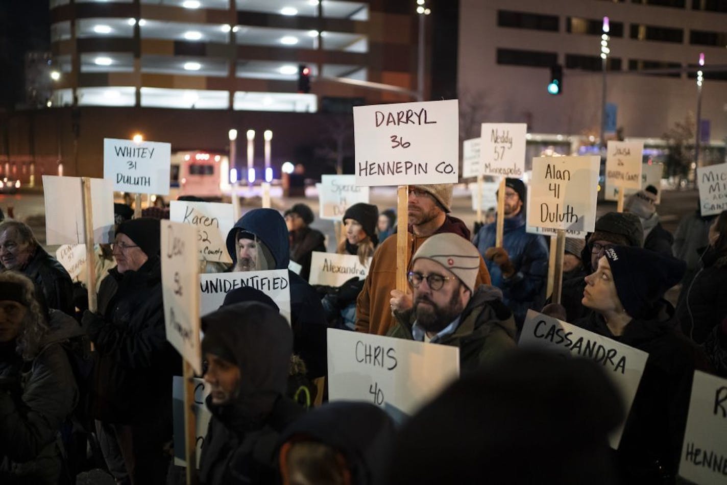 Several hundred people marched in the silent Homeless Memorial March carrying signs that recognized the 190 homeless, previously homeless and advocates for the homeless that died in 2019 on Thursday, December 19, 2019 through downtown Minneapolis, Minn.