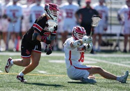 Lakeville North’s Quinn Power, left, goes on the attack in Thursday's semifinal against Stillwater.