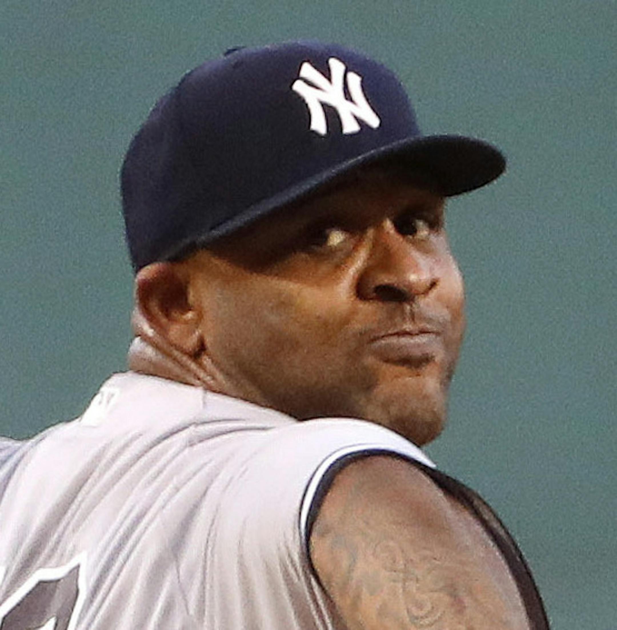 New York Yankees starting pitcher CC Sabathia delivers against the Boston Red Sox during the first inning of a baseball game at Fenway Park in Boston Saturday, Aug. 19, 2017. (AP Photo/Winslow Townson)
