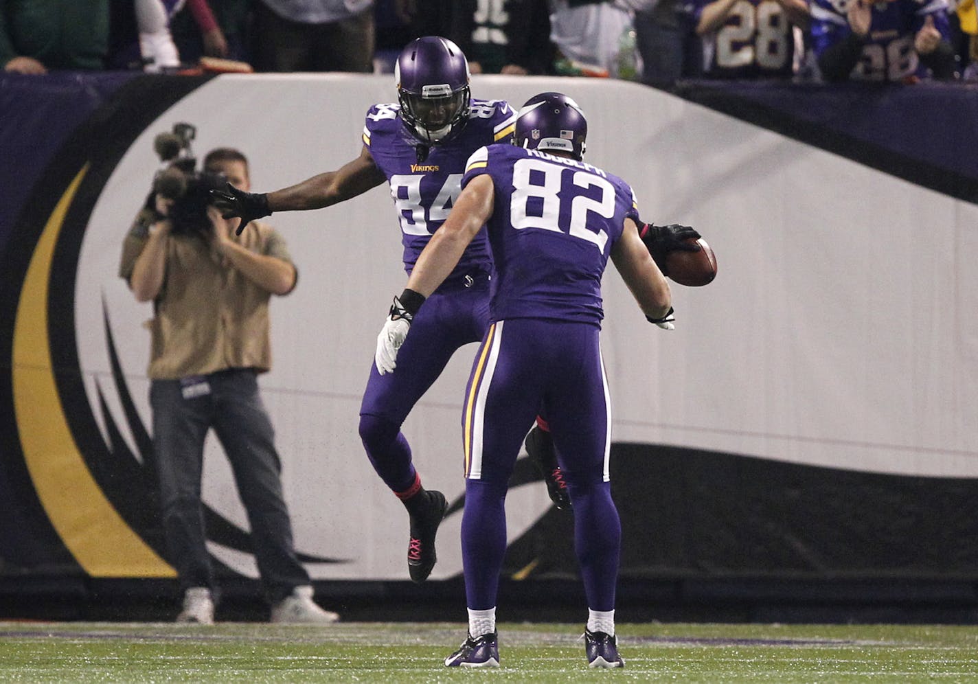 Minnesota Vikings wide receiver Cordarrelle Patterson (84) celebrates his touchdown run on the kickoff return in the first half an NFL football game against the Green Bay Packers, Sunday, Oct. 27, 2013, in Minneapolis. (AP Photo/Kiichiro Sato)