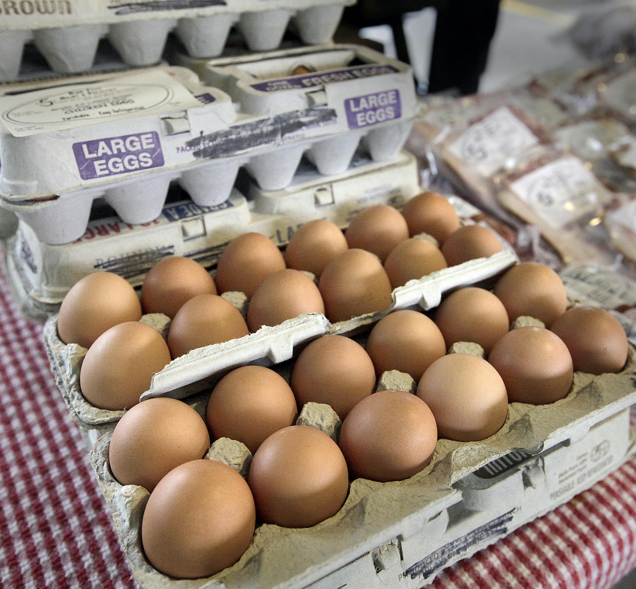 Bar Five Meats & Poultry sales table with eggs sold by Dawn Schwirtz, Roger Schwatz
