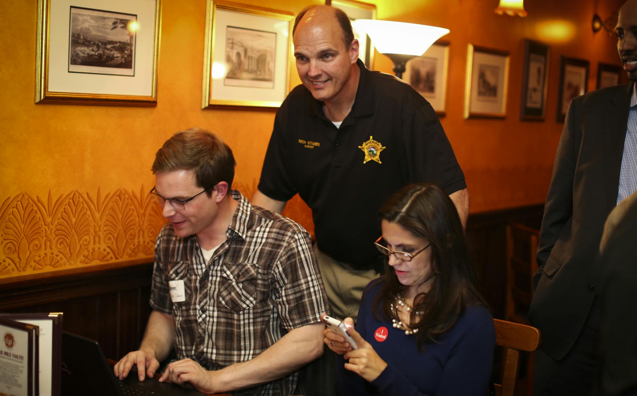 Hennepin County incumbent Sheriff Rich Stanek (in black) watched results come in at an election night party at Kip's Irish Pub in St. Louis Park, Minn., on Tuesday, November 4, 2014. ] RENEE JONES SCHNEIDER • reneejones@startribune.com