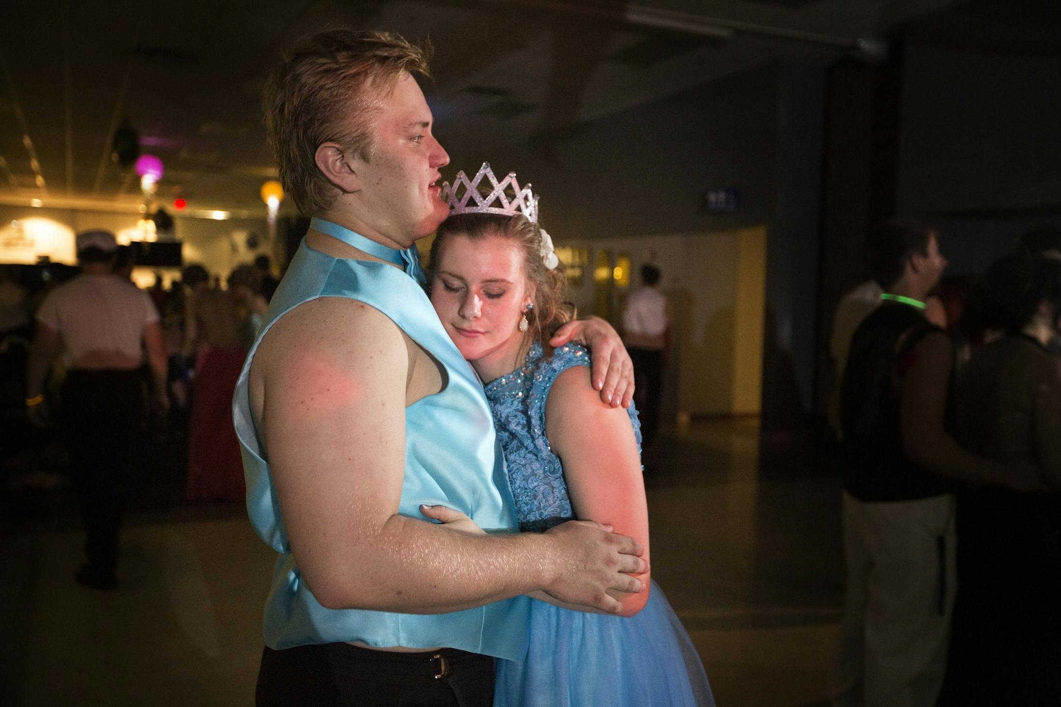 Juniors Kallie Olson and Evan Hendrickson slow dance at prom. Both have parents who currently work in the mining industry.