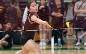 St. Paul Johnson's Su Meh returns a shot during her victory Thursday over St. Paul Harding's Gaozhia Vue for the singles state championship in badmint