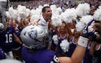 University of St. Thomas coach Glenn Caruso celebrated with his team after a 207 victory over St. John's. at Target Field in Minneapolis.