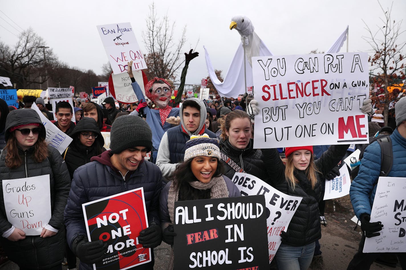 Students, including Aashay Desai, 16, left, and Aashna Sheth, 16, both of Plymouth, gathered at Harriet Island Regional Park in St. Paul before matching to the State Capitol protesting gun violence Saturday.