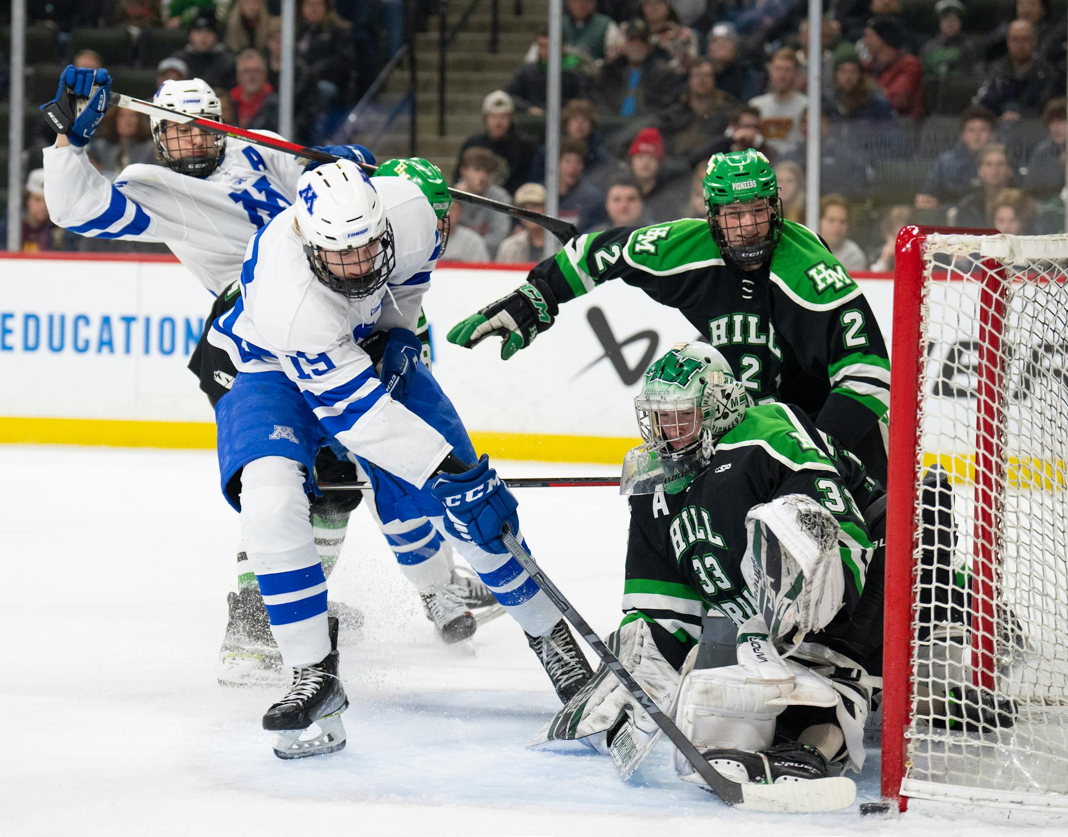 Minnetonka Skippers forward Hagen Burrows (19) just missed slipping the puck past Hill-Murray Pioneers goaltender Jack Erickson (33) in the first period. Minnetonka faced Hill-Murray in a State Class AA Boys Hockey Tournament quarterfinal game Thursday night, March 9, 2023 at Xcel Energy Center in St. Paul.