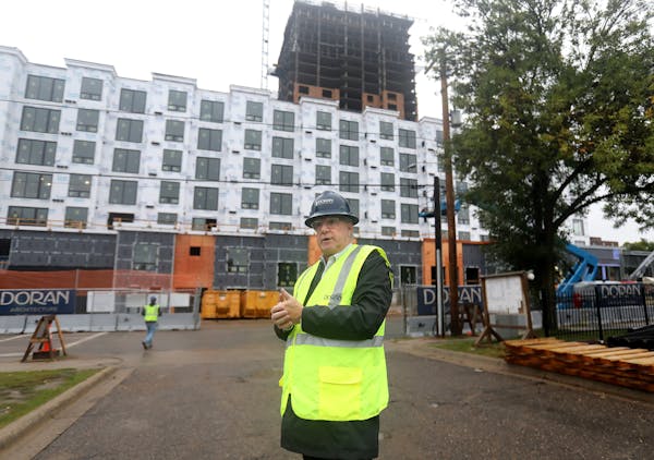 Founder Kelly Doran outside the 25-story Expo apartment tower under construction by Doran Development Wednesday, Sept, 11, 2019, in Minneapolis, MN.] 