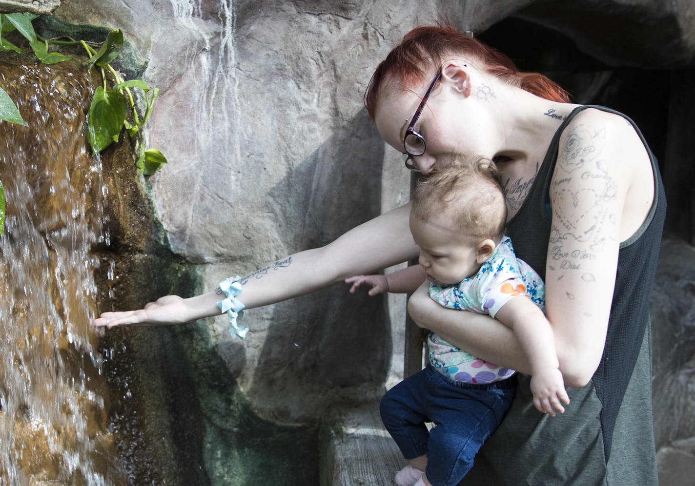 Sarah Griefenhagen, of Fridley, held her four-month old daughter Carollyn (CQ) while walked through the tropics exhibit at the Minnesota Zoo on Monday, February 13, 2017 in Apple Valley, Minn. ] RENEE JONES SCHNEIDER &#x2022; renee.jones@startribune.com