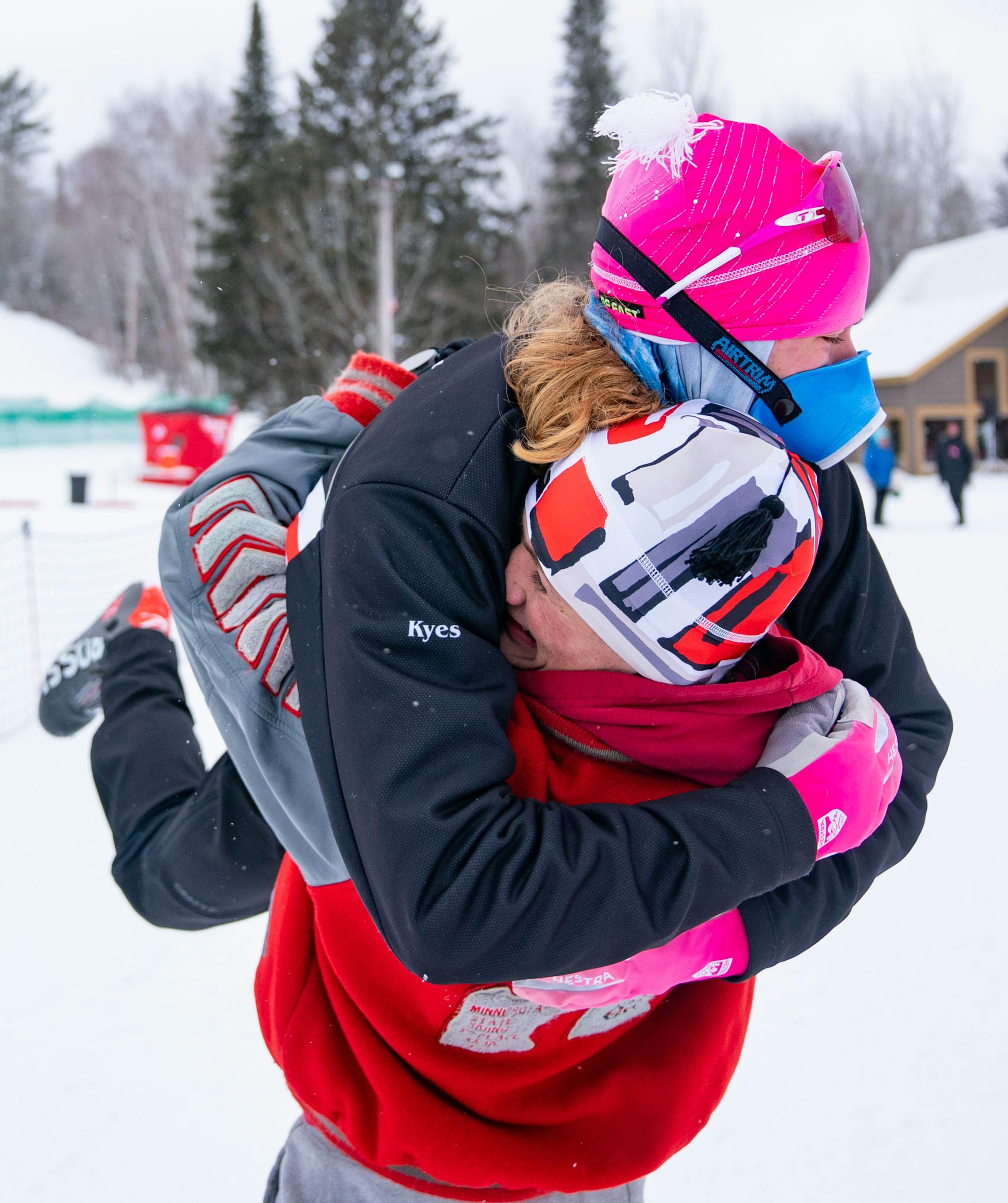 Duluth East nordic skier Aiden Van Straten hugs his teammate, James Kyes, after Kyes took first place in the boy's team sprint final during the MSHSL Boys and Girls Nordic Ski Racing Meet.