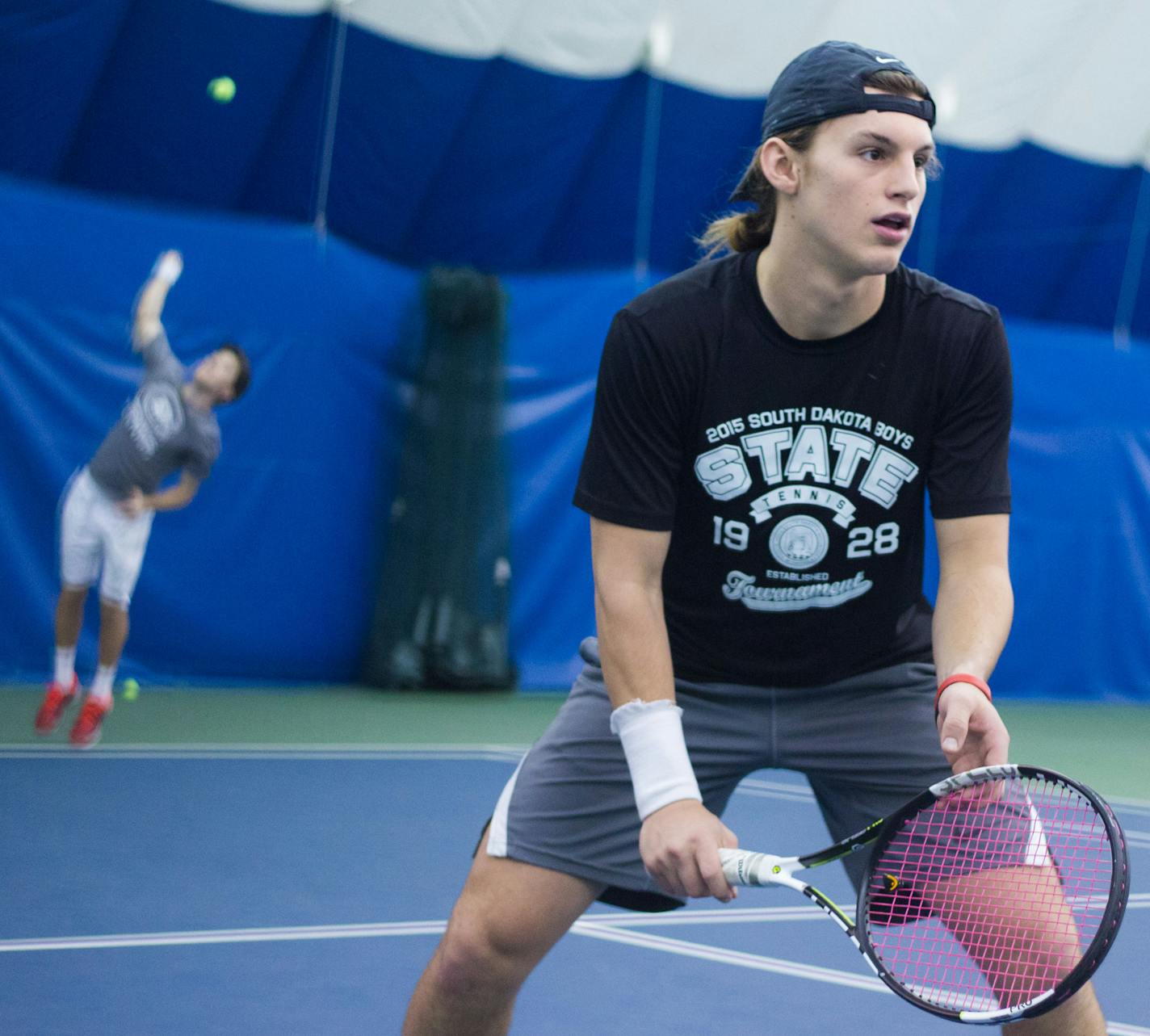 Sophmore Lucas Norbiato from Brazil serves as teammate Jacob Cersosimo Freshman plays two on two during practice.] Elizabeth Brumley special to Star Tribune ] St. Cloud State has decided to drop a number of sports programs including Tennis. The men's tennis team practice at Fitness Evolution in Sartell, MN.