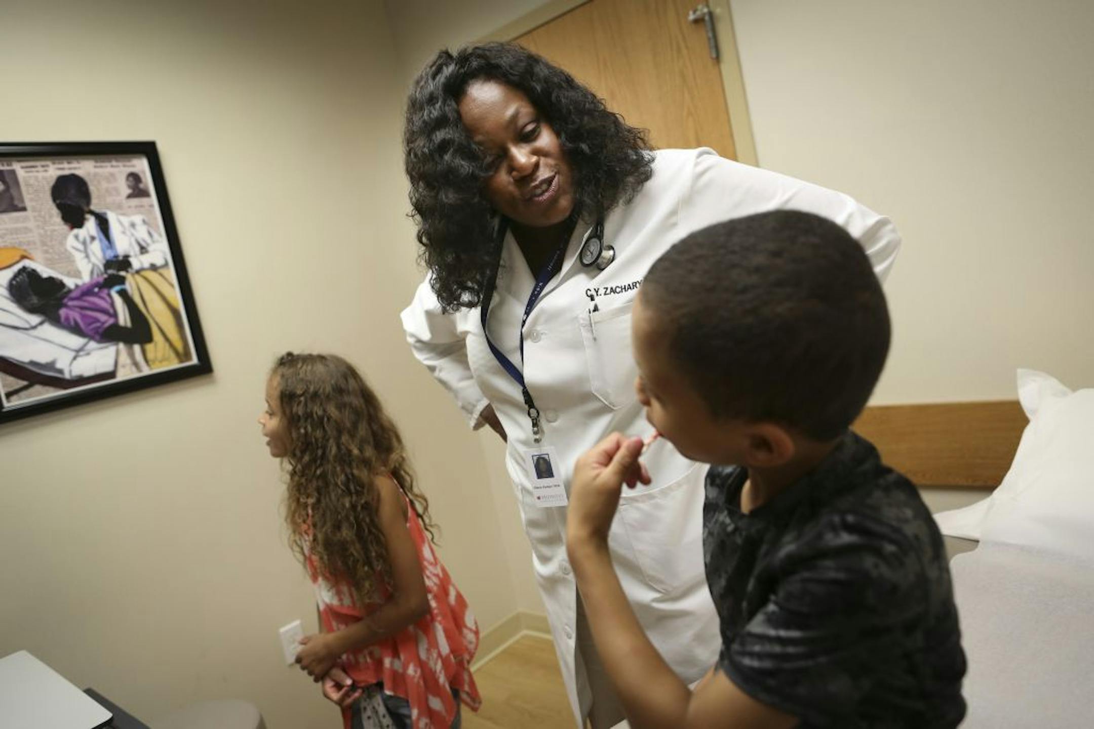 At Midwest Allergy and Asthma in Burnsville, Dr. Cherie Zachary responded to patient Jamison Rowe, 6, when he asked if the doctor in the painting on the wall was her. The Disney Jr. animated show "Doc McStuffins" stars a black female doctor who has been praised as a role model for young minority girls.