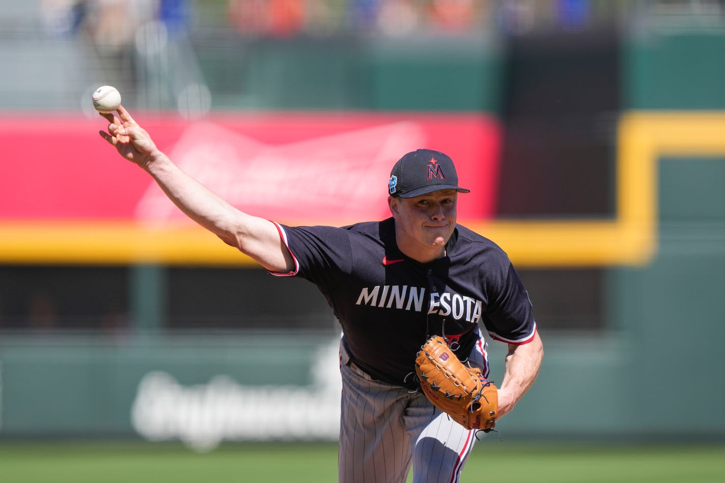 Minnesota Twins starting pitcher Louie Varland (37) throws in the first inning of a spring training baseball game against the Atlanta Braves in North Port, Fla., Saturday, March 4, 2023. (AP Photo/Gerald Herbert)