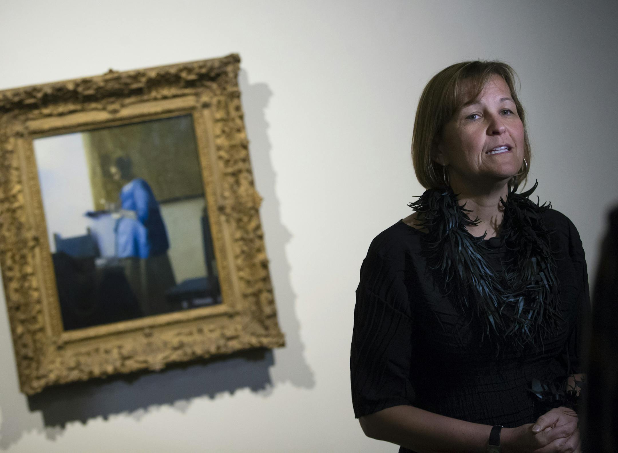 MIA Museum director Kaywin Feldman talked about the painting by Johannes Vermeer Woman in Blue Reading Letter at the staff unveiling of the Minneapolis Institute of Arts' first big "surprise" of its centennial year on Friday, January 16, 2015, in Mineapolis, Minn. ] RENEE JONES SCHNEIDER &#x2022; renee.jones@yahoo.com