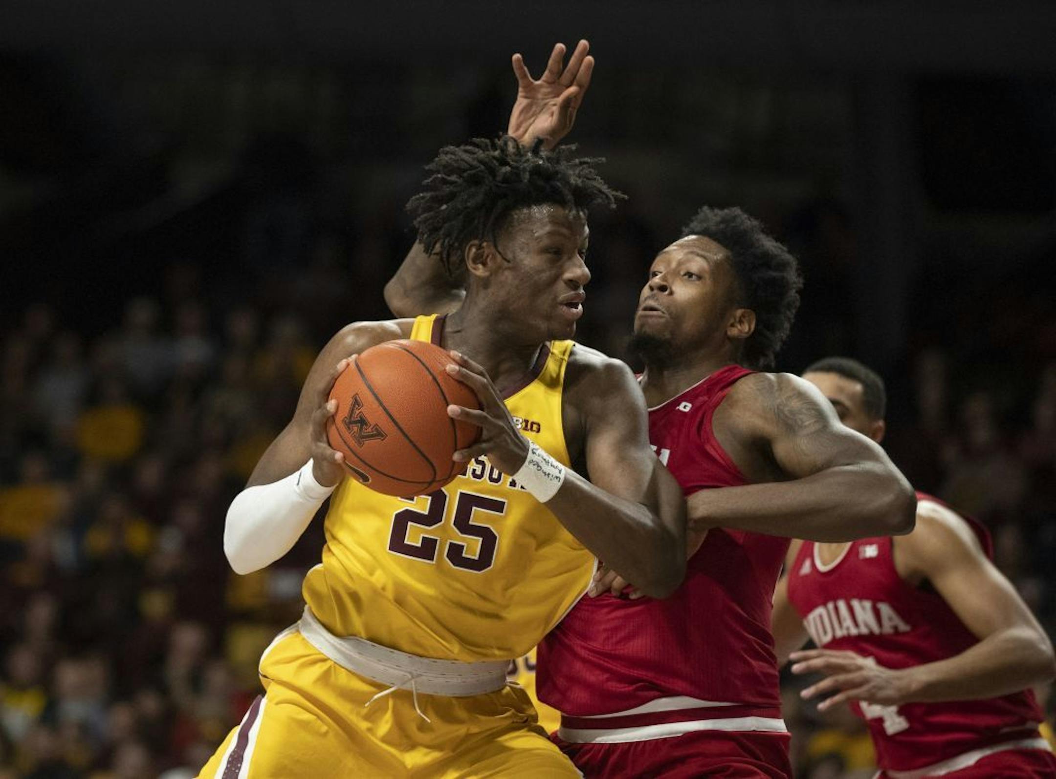 Gophers center Daniel Oturu posted up Hoosiers forward De'Ron Davis in the first half at Williams Arena on Wednesday night.