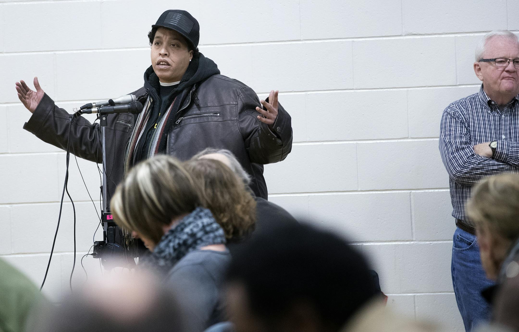 Chauntyll Allen of St. Paul spoke during a Department of Justice listening session at Falcon Heights Elementary School on Monday night.