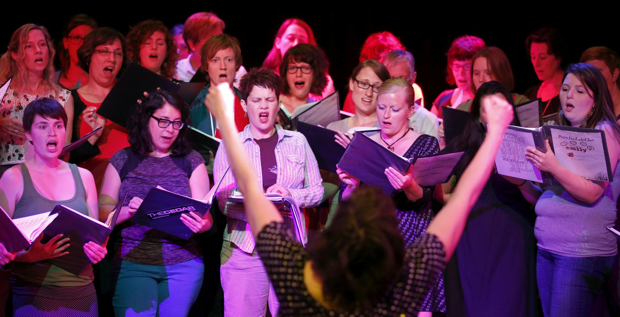 Aby Wolf conducted a song sang by the Prairie Fire Lady Choir during a filming of Soundcheck at the McNally Smith College of Music in St. Paul. ] CARLOS GONZALEZ cgonzalez@startribune.com - June 2, 2014, St. Paul, Minn., McNally Smith College of Music, Profile on the Prairie Fire Lady Choir, a 40-member all-female vocal group that sings Bowie & Magnetic Fields songs but now has original tunes written with local singer Aby Wolf , Soundcheck video