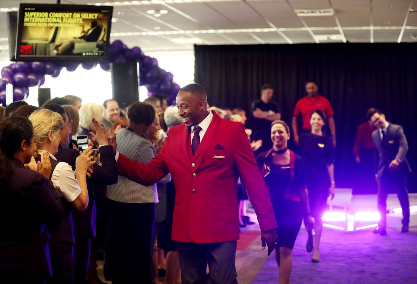 Delta Air Lines launched its new line of uniforms for all its employees during a fashion show at MSP with designer Zac Posen & manufacturer Lands End showcasing the new look Tuesday, May, 29, 2018, at Terminal 1 between Gates G1-G3 at the Minneapolis-St. Paul International Airport in Bloomington, MN. Here, Delta employees in the fashion show took one last walk down the runway to the delight of other employees and onlookers.] DAVID JOLES &#xef; david.joles@startribune.com Delta Air Lines is launc