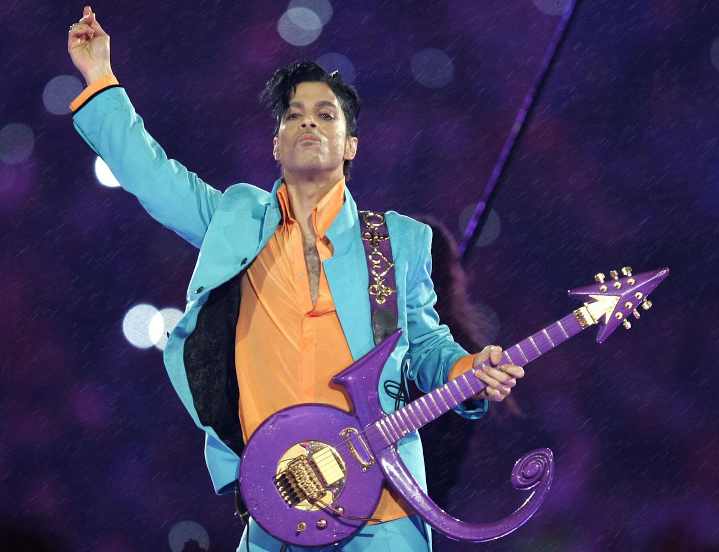 FILE - In this Feb. 4, 2007, file photo, Prince performs during the halftime show at the Super Bowl XLI football game at Dolphin Stadium in Miami. Organizers of a family-sanctioned Prince tribute concert in his hometown of Minneapolis have yet to announce a lineup of musicians or ticket sale plans for the Oct. 13 show at the city's new NFL stadium. The delay has frustrated Prince fans who've already booked flights and rooms in anticipation, but they said they took some heart Thursday, Sept. 15,