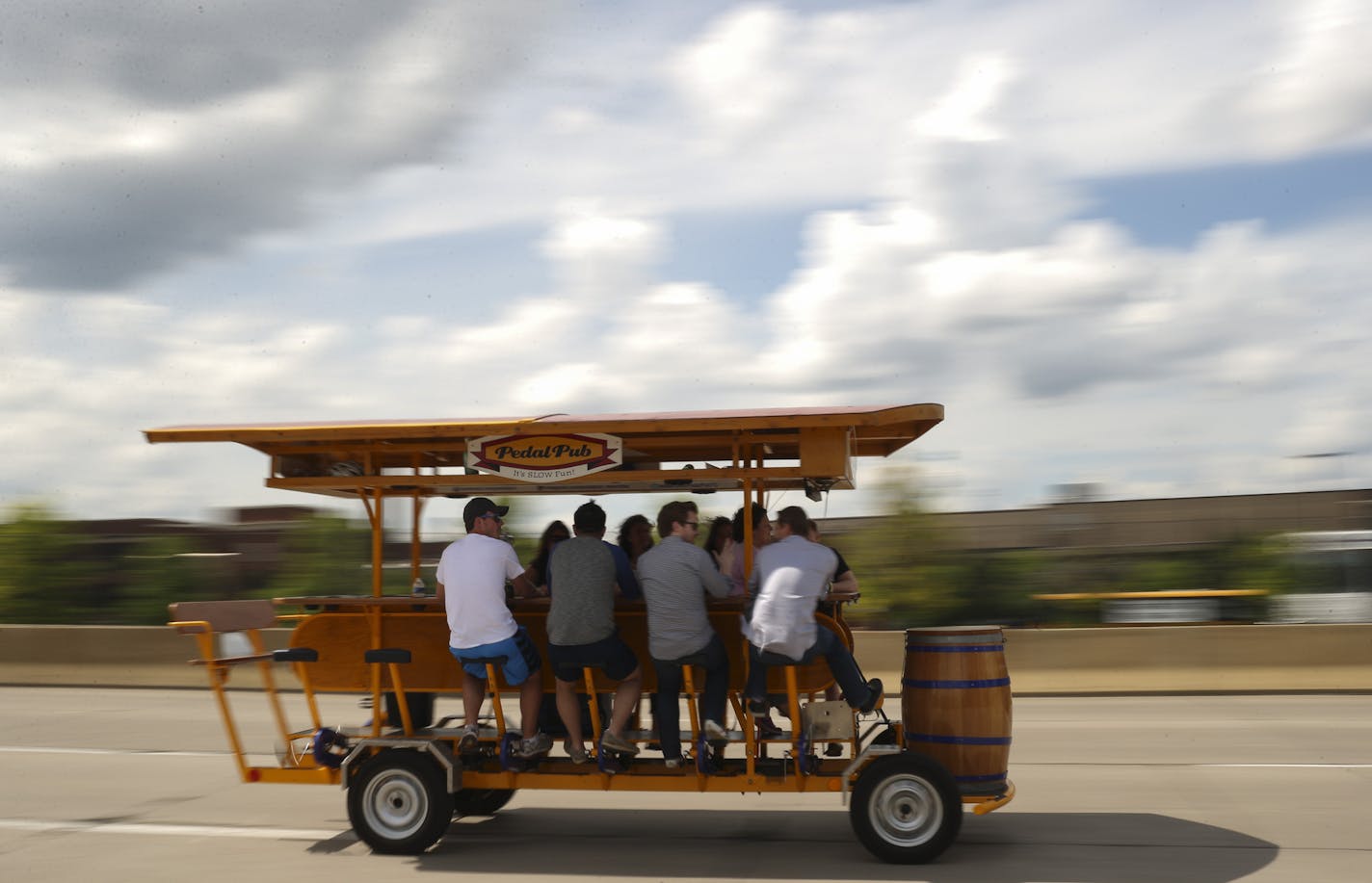 A Pedal Pub crossed the Hennepin Ave. bridge at the beginning of a tour Thursday evening. ] JEFF WHEELER &#xef; jeff.wheeler@startribune.com Pedal Pubs were back on the streets Thursday night, June 25, 2015 in Minneapolis after one was hit on the Hennepin Ave. bridge the previous night.