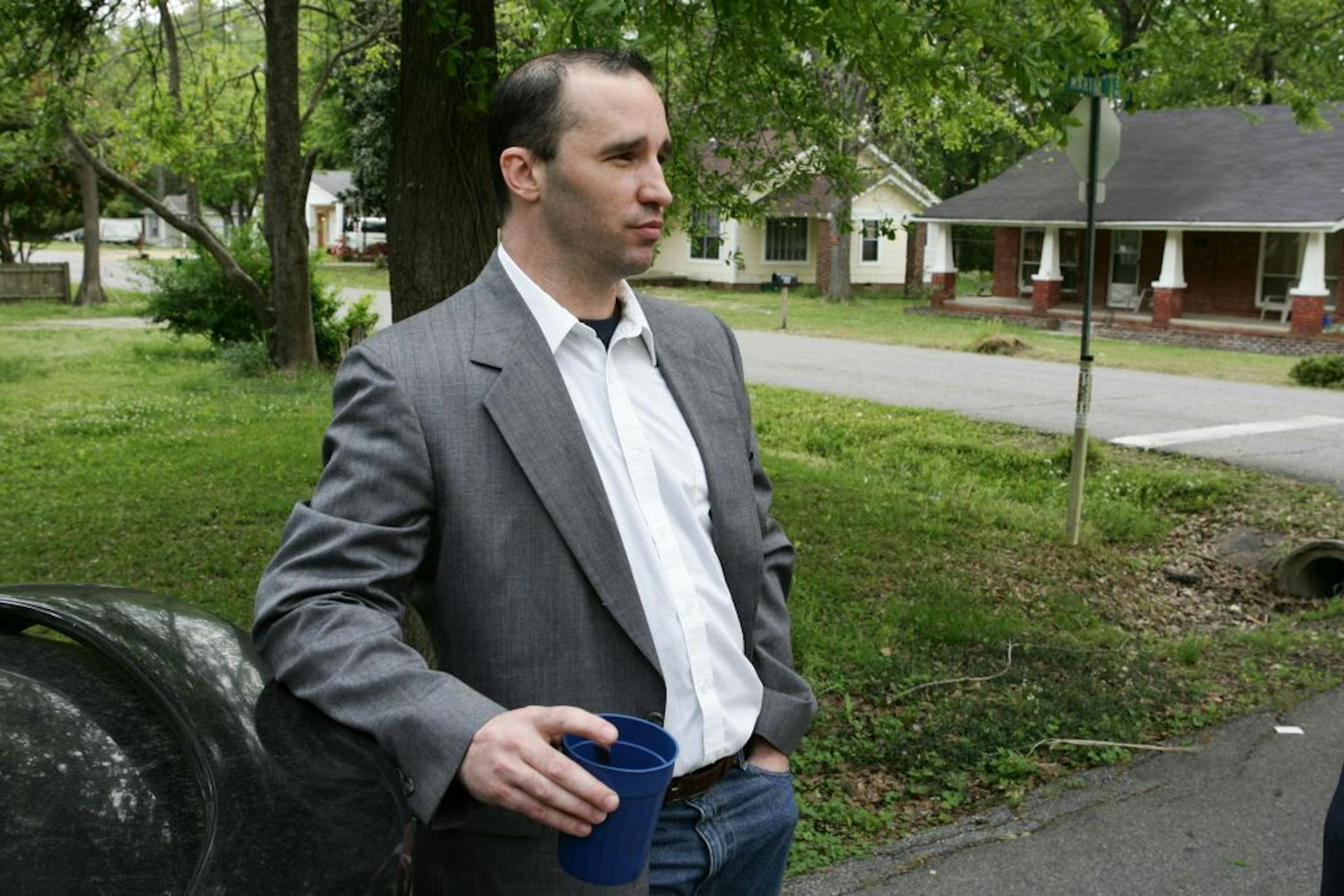 FILE - In this Tuesday April 23, 2013 file photo, Everett Dutschke stands in the street near his home in Tupelo, Miss., and waits for the FBI to arrive and search his home in connection with the sending of poisoned letters to President Barack Obama and others. FBI spokeswoman Deborah Madden says Dutschke, 41, was arrested Saturday, April 27, 2013, at his Tupelo home in connection with the letters, which allegedly contained ricin. They were sent last week to Obama, Sen. Roger Wicker of Mississipp