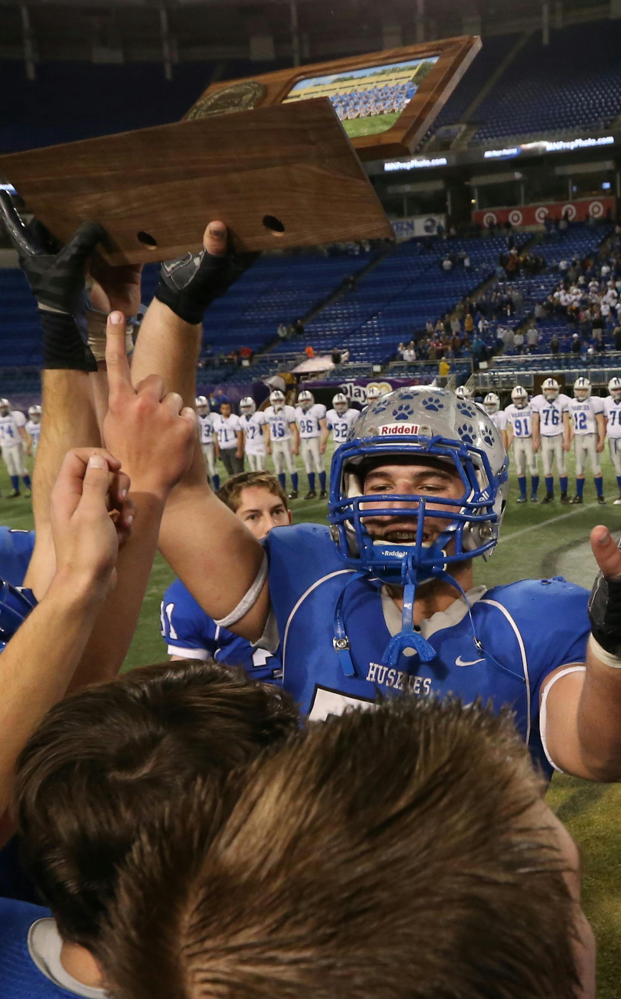 Minnesota State High School League Prep Bowl Championship Games, Metrodome, 11/30/13. Brainerd vs. Owatonna, Class A Championship. (left to right) Owatonna celebrated their win over Brainerd.] Bruce Bisping/Star Tribune bbisping@startribune.com ORG XMIT: MIN1311301924012073