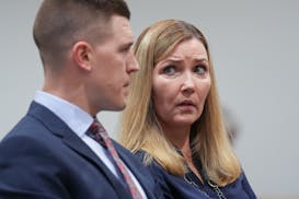 Sen. Nicole Mitchell, DFL-Woodbury, sits in a Senate ethics committee hearing at the State Capitol with attorney Dane DeKrey on Wednesday, June 12.