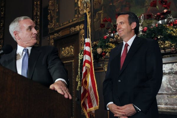 In the governor's reception room at the State Capitol, governor-elect Mark Dayton and governor Tim Pawlenty addressed transition issues at a press con