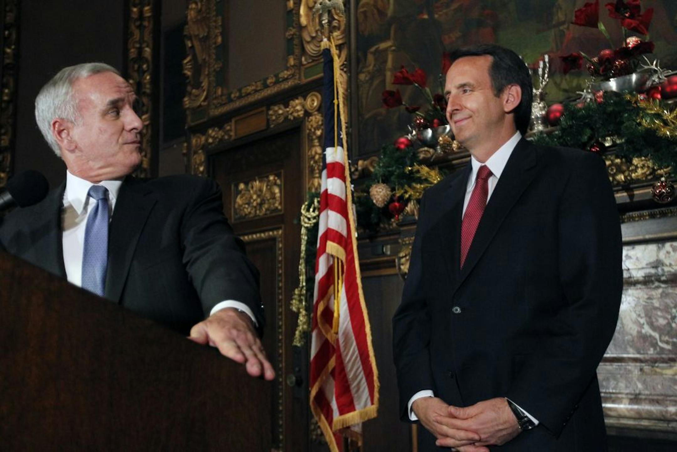 In the governor's reception room at the State Capitol, governor-elect Mark Dayton and governor Tim Pawlenty addressed transition issues at a press conference.