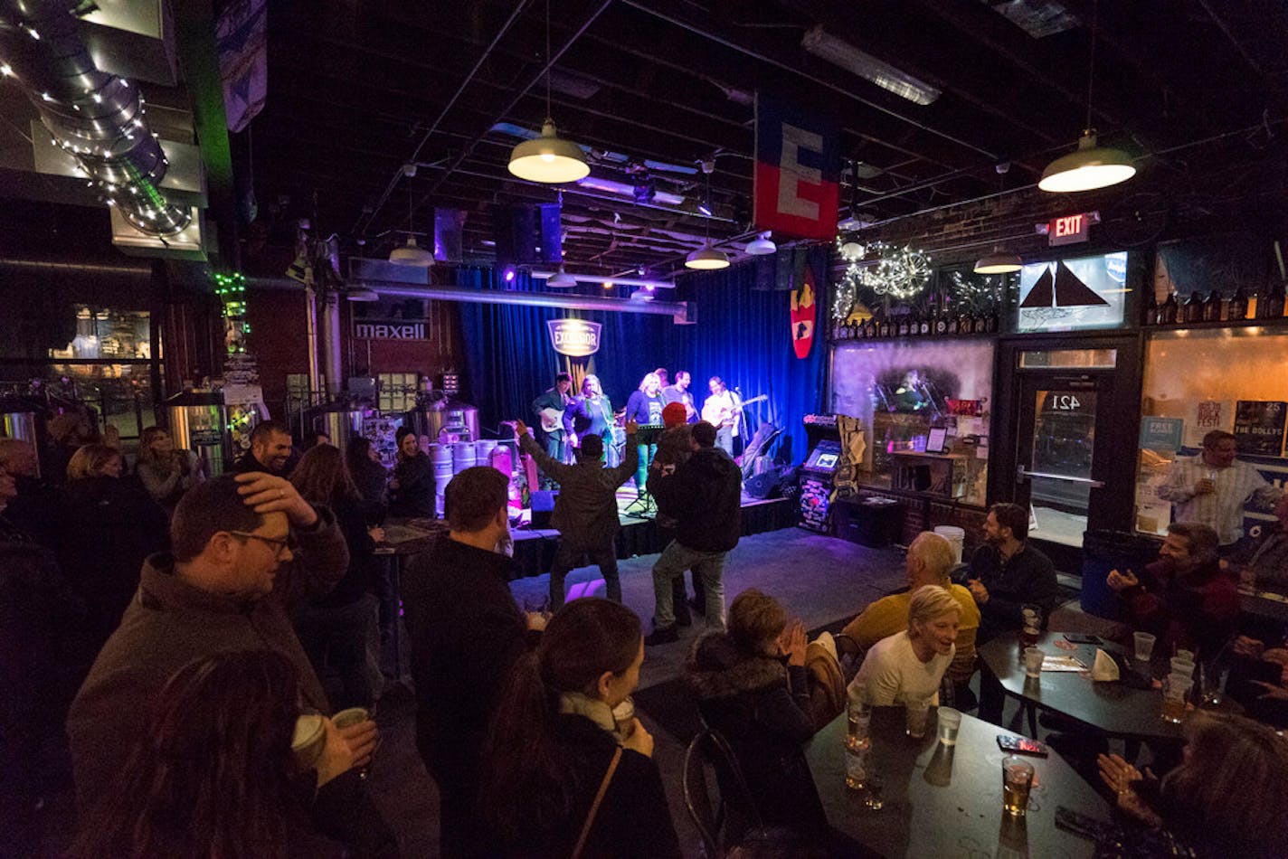 The Dollys, a band from Minneapolis plays for a full audience at Excelsior Brewing on Friday, Jan 25.] TONY SAUNDERS tony.saunders@startribune.com People dance on the floor, stand, or sit at tables with their beers to watch the Dollys perform songs from artists like Eric Clapton, Hank Williams, and Dolly Parton.