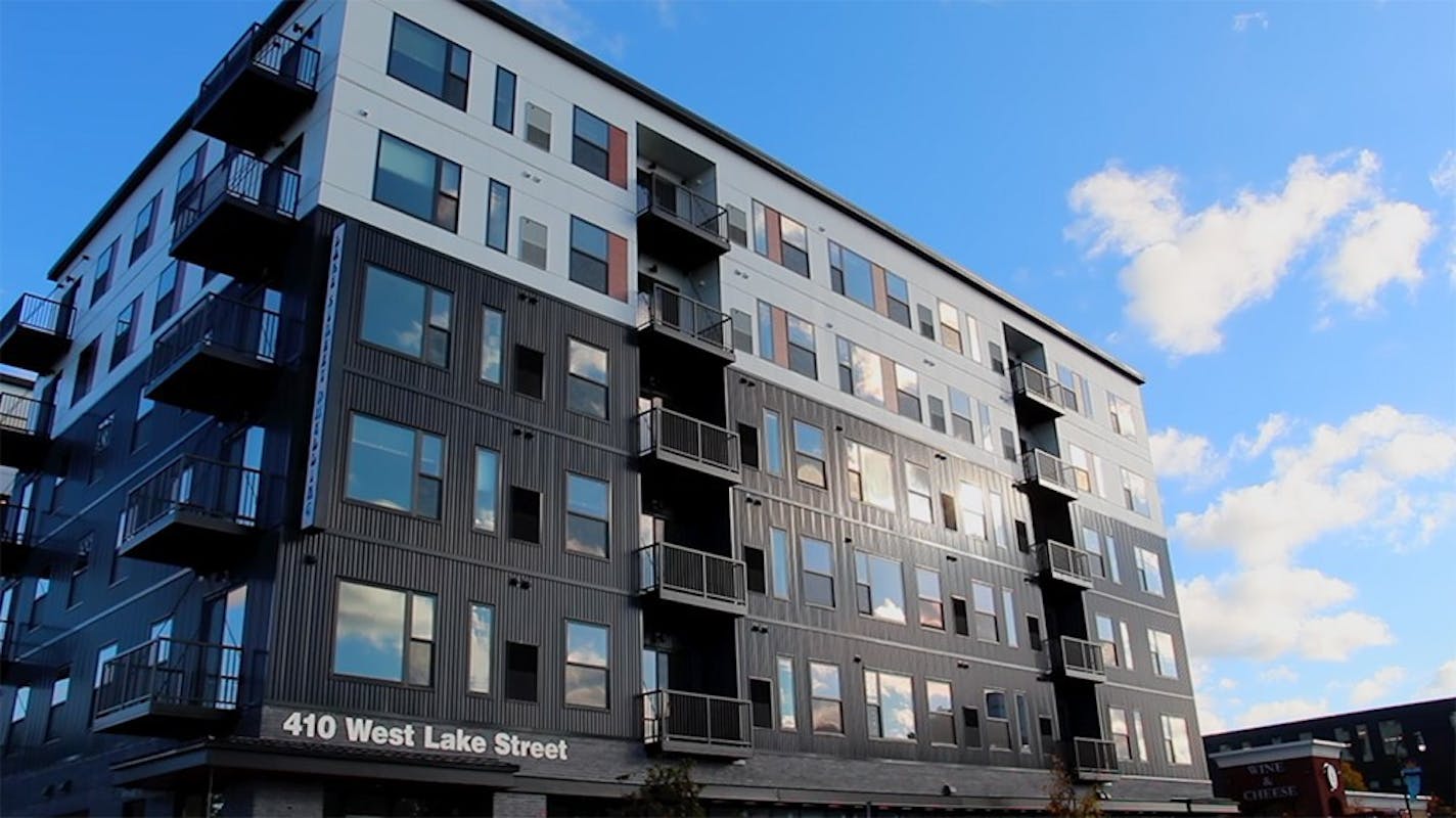 Twin Cities-based Lupe Development Partners has moved forward this month on two rental projects aimed at low-income renters: An 111-unit building that opened recently on Lake Street in Minneapolis, shown here, and a senior rental building in Edina that's in its infancy. Credit: Lupe Development