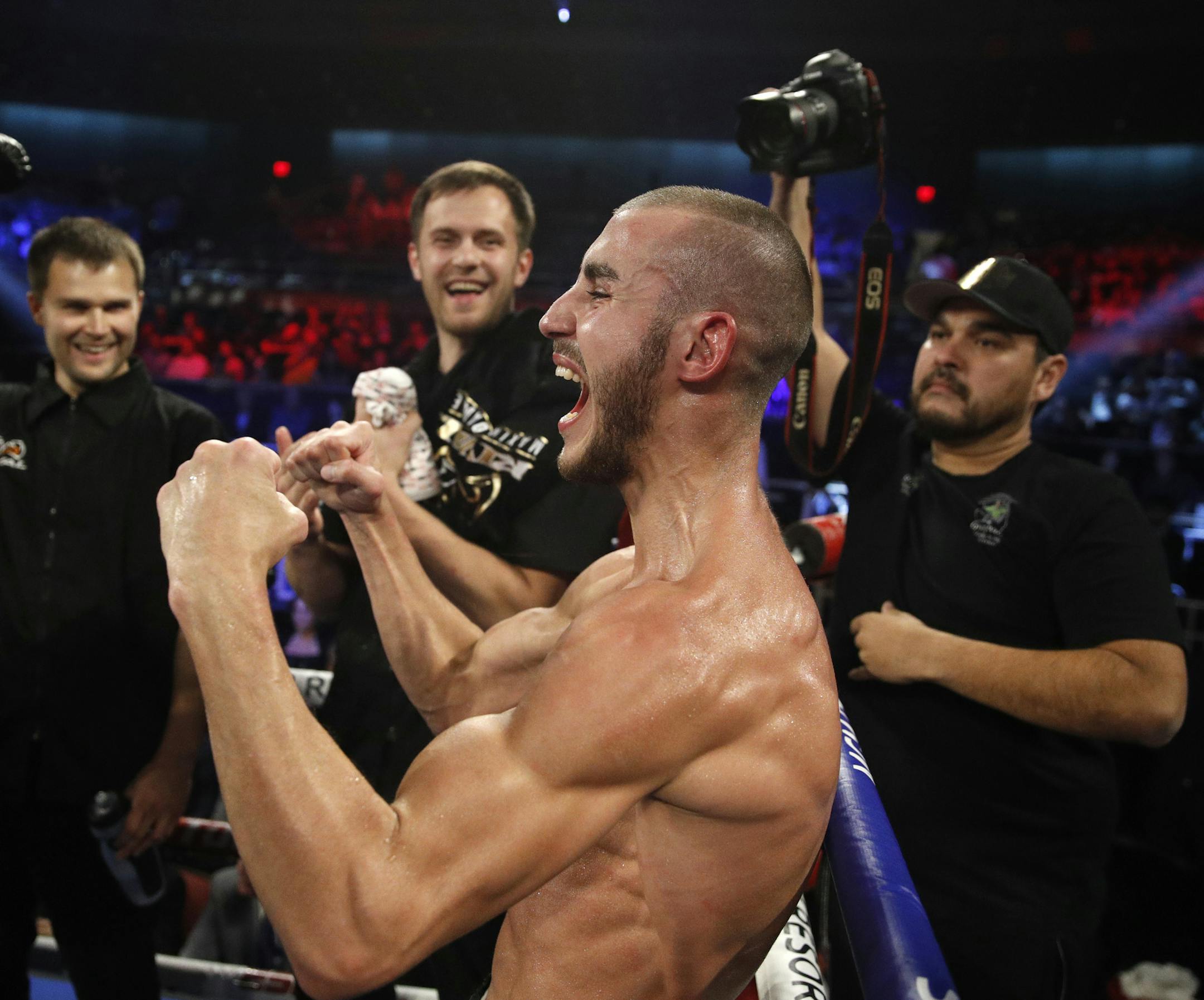 FILE - In this Saturday, Oct. 20, 2018 file photo, Maxim Dadashev celebrates after defeating Antonio DeMarco during a junior welterweight bout in Las Vegas. On Saturday, July 20, 2019, doctors said Dadashev had surgery at a Maryland hospital for swelling on his brain after collapsing outside the ring after losing a match. (AP Photo/John Locher)