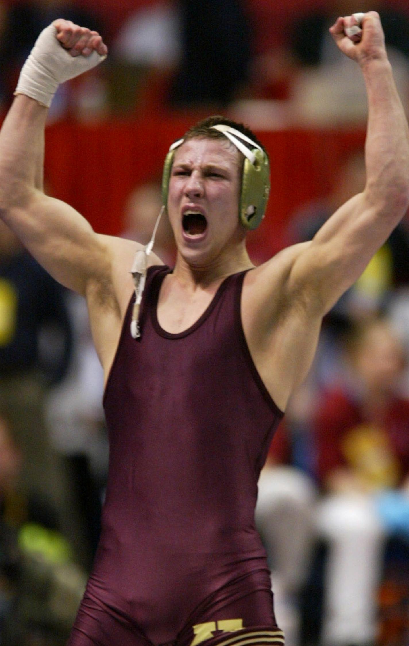 Albany New York 3/22/02 NCAA Wrestling Championships semifinals---Jared Lawrence of Minnesota celebrates his win over JaMarr (cq) Billman of Lock Haven in the 149 class semifinal championship round. ORG XMIT: MIN2014121821113038