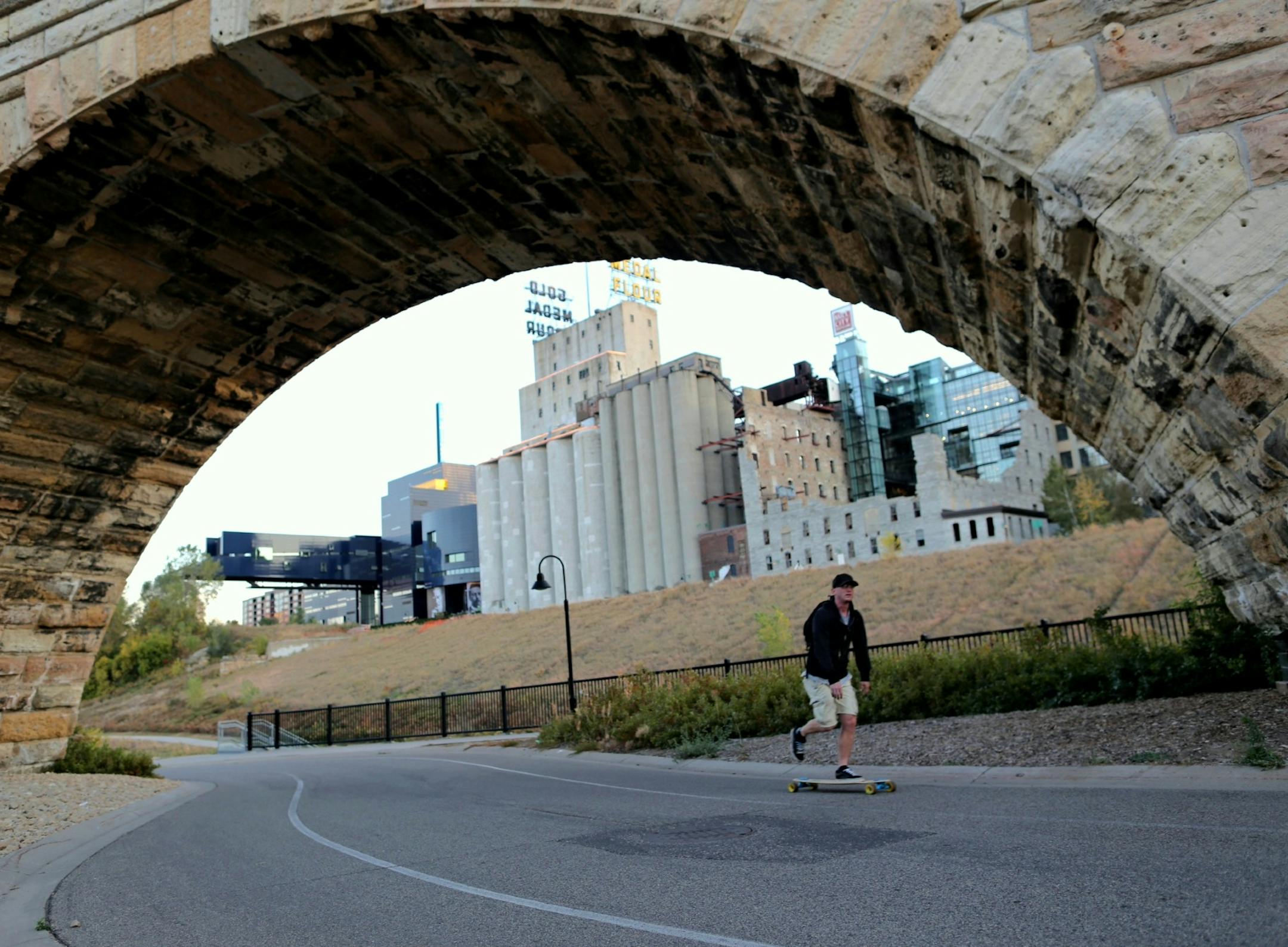 Eric Pounders rode his skateboad under the Stone Arch Bridge at dusk on Monday, October 1, 2012 in Minneapolis, Minn. ] (RENEE JONES SCHNEIDER * reneejones@startribune.com)