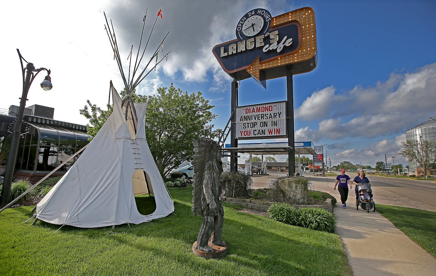 An Indian Tipi and a Native American Chief statue mark the front lawn to Lange's Cafe, Tuesday, May 10, 2016 in Pipestone, MN. The glass front door to Lange's Cafe has been repaired, its closures replaced. But not once in 60 years has it ever been locked. The man who opened this classic diner, open 24 hours a day, 7 days a week, threw the keys in the wet cement and shouted "Here's to never closing," owner Steve Lange, said. ] (ELIZABETH FLORES/STAR TRIBUNE) ELIZABETH FLORES &#x2022; eflores@star