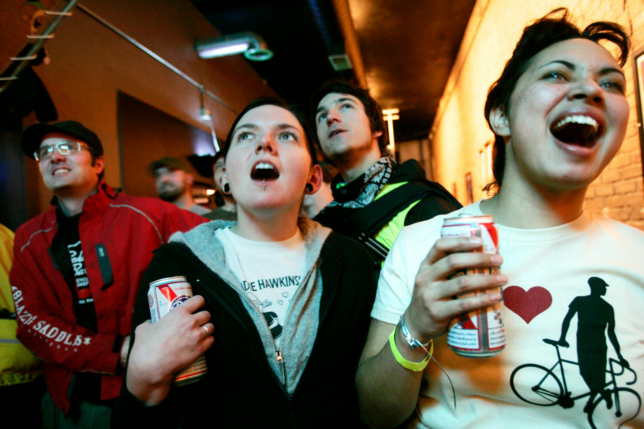 Kayla Dotson, second from left, and Marie Snyder cheered the competitors.