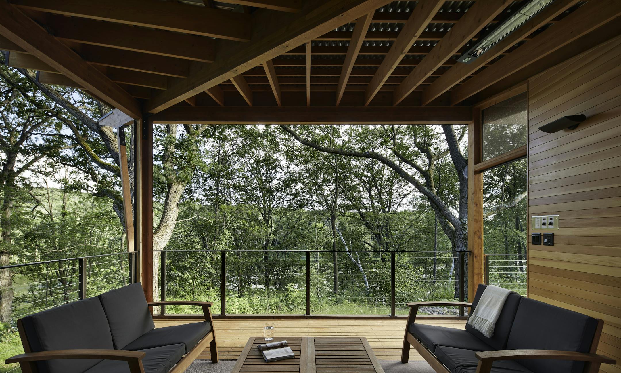Set against a backdrop of rolling hills and prairie, SALA Architect's Home of the Month winning retreat is an restorative getaway in Frederic, Wis. that also restores the land.