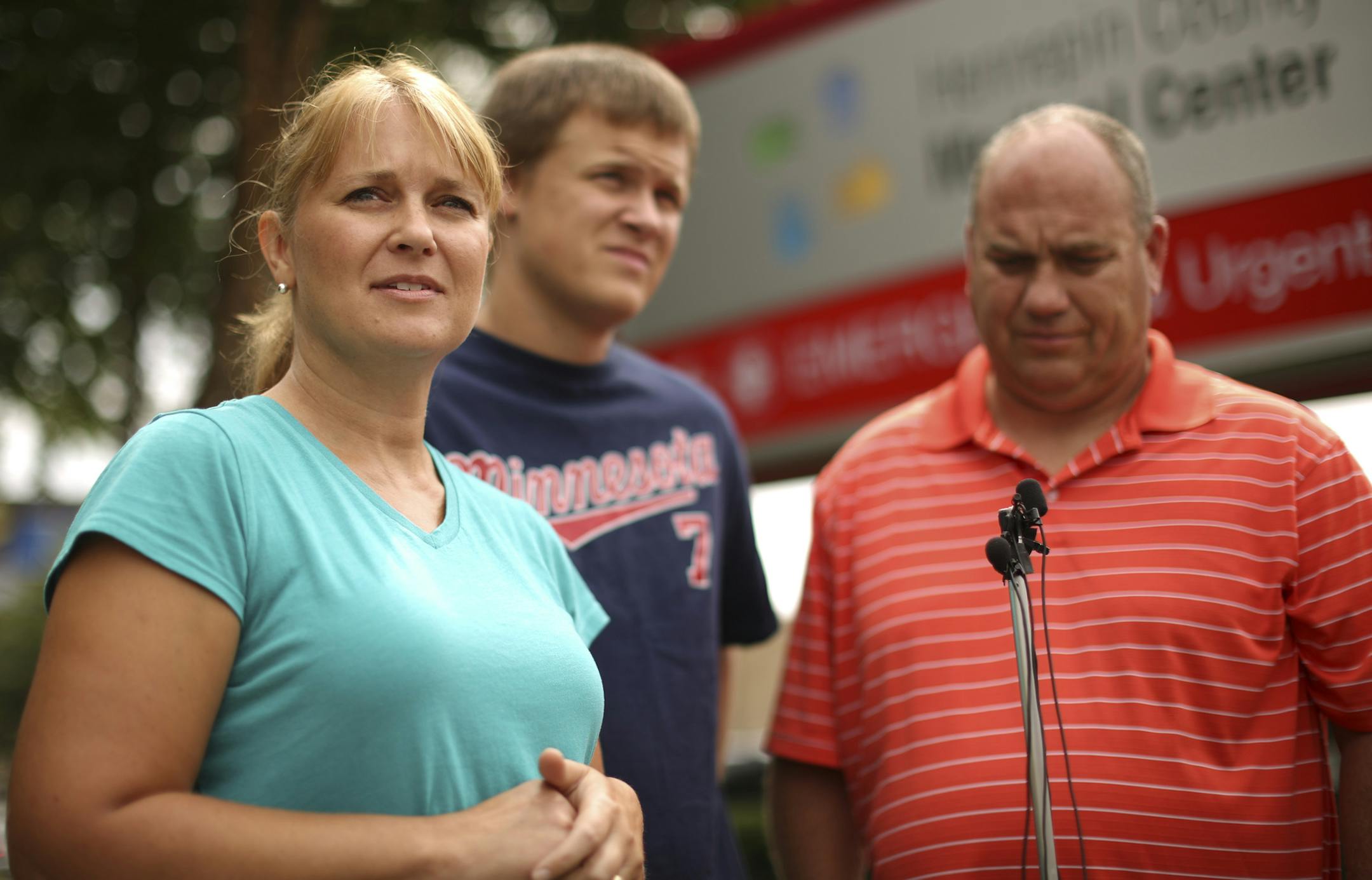 The family of Luke Nelson, the Dassel-Cokato High School middle linebacker who suffered a head injury in a football game Friday night, spoke to members of the news media about their son outside Hennepin County Medical Center Sunday afternoon, September 8, 2013. Luke's mother, Sara, brother, Isaac, and father, Greg, from left, talked about his injury, which doctors treated by removing a portion of his skull to relieve pressure from the injury. ] JEFF WHEELER ‚Ä¢ jeff.wheeler@star