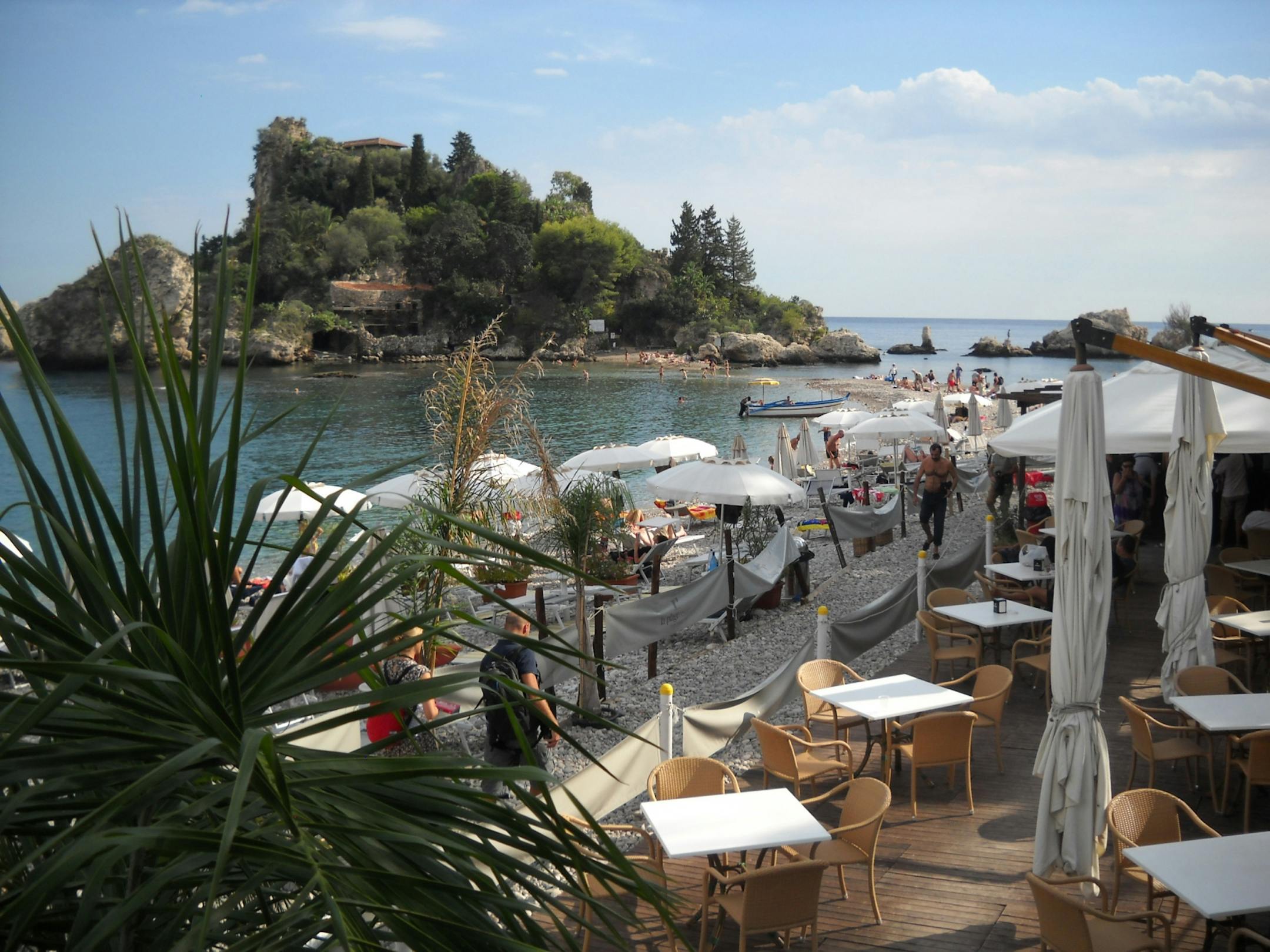 With its white beaches and superb seaside restaurants, Sicily's Taormina has been drawing tourists since traveling ancient Greeks discovered its charms.