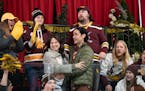 Katie Lowes and Jesse Bradford, center, star in “Merry Kiss Cam,” a sporty holiday rom-com that was filmed in Duluth.
