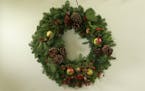 A holiday wreath crafted for use through the winter .