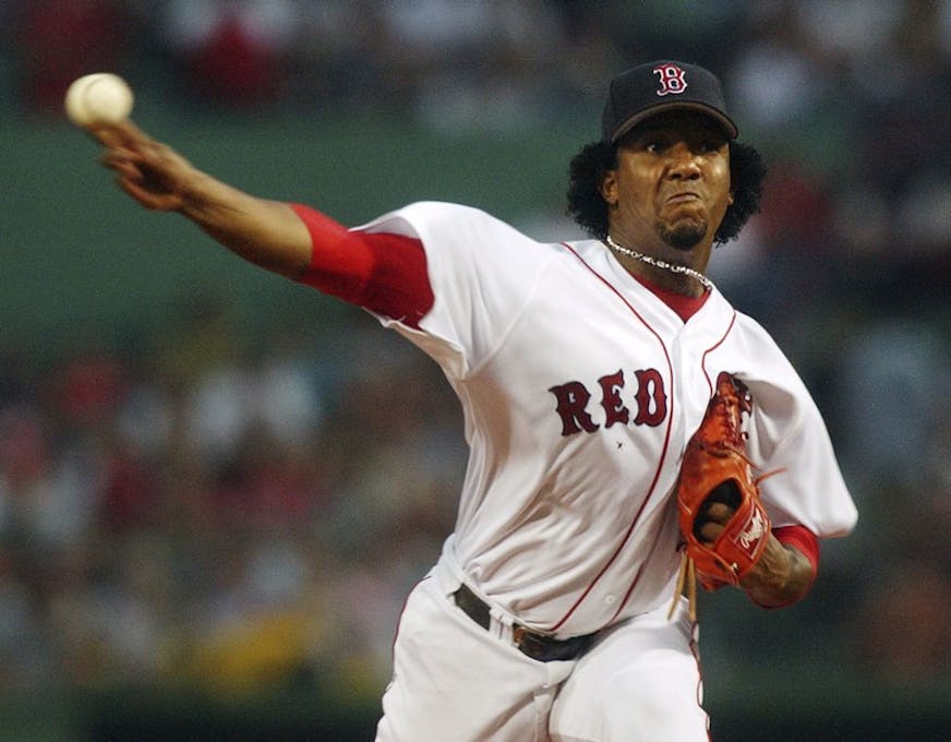 FILE - In this June 25, 2004 file photo, Boston Red Sox starting pitcher Pedro Martinez delivers during the first inning of a Major League baseball game against the Philadelphia Phillies at Fenway Park in Boston. Martinez is among among 17 first-time candidates on the 2015 Baseball Hall of Fame ballot.