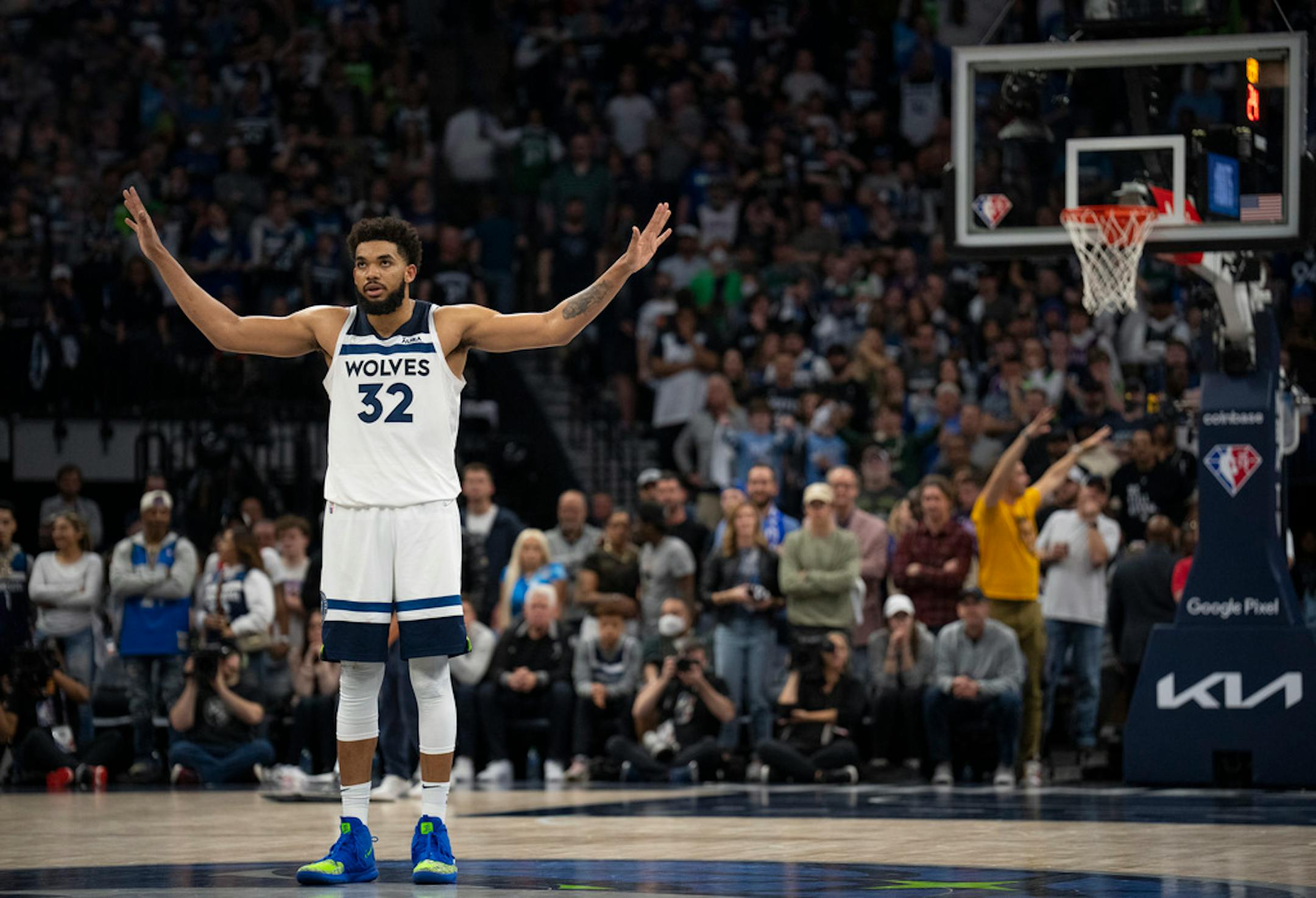 Minnesota Timberwolves center Karl-Anthony Towns (32) signaled the crowd to quiet down for a teammate to shoot free throws late in the fourth quarter Saturday night, April 23, 2022 at Target Center in Minneapolis. The Minnesota Timberwolves defeated the Memphis Grizzlies 119-118 in game 4 of their NBA first round playoff series.   ]   JEFF WHEELER • Jeff.Wheeler@startribune.com