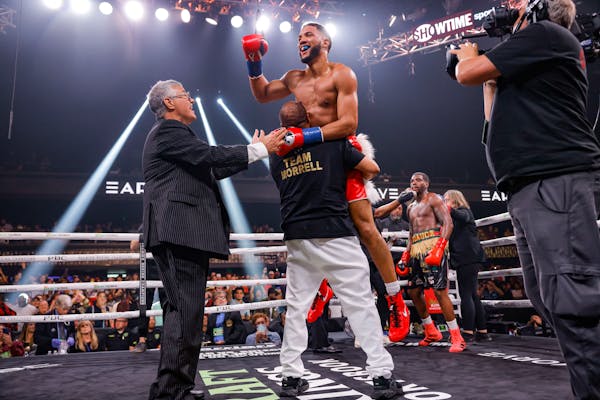 CORRECTS TO DAVID David Morrell Jr. celebrated his fourth-round knockout of Kalvin Henderson on Saturday, June 4, 2022 at the Minneapolis Armory. Morr