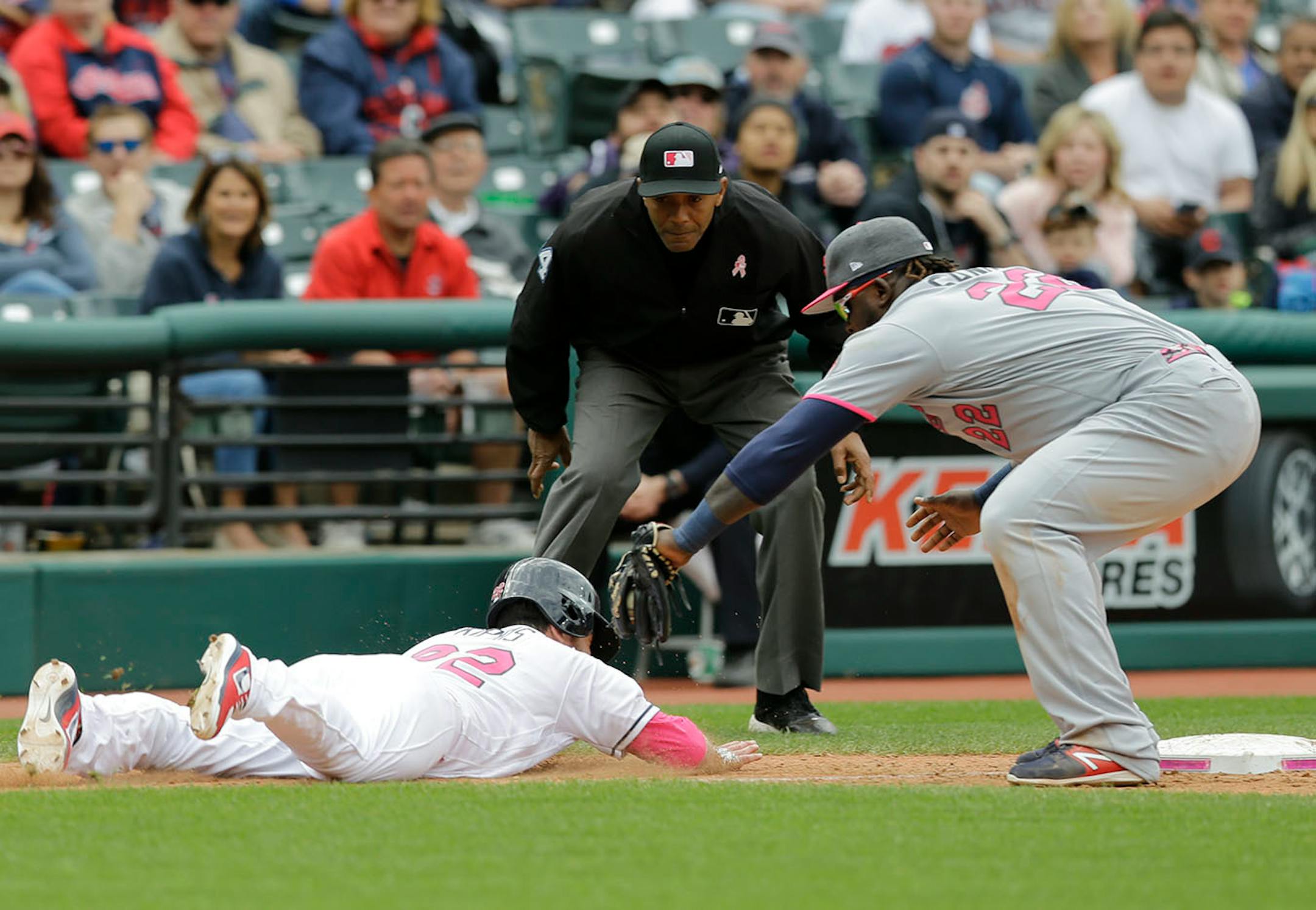 Minnesota Twins' Miguel Sano tags out Cleveland Indians' Jason Kipnis in the eighth inning of a baseball game, Sunday, May 14, 2017, in Cleveland. The Indians won 8-3. (AP Photo/Tony Dejak)