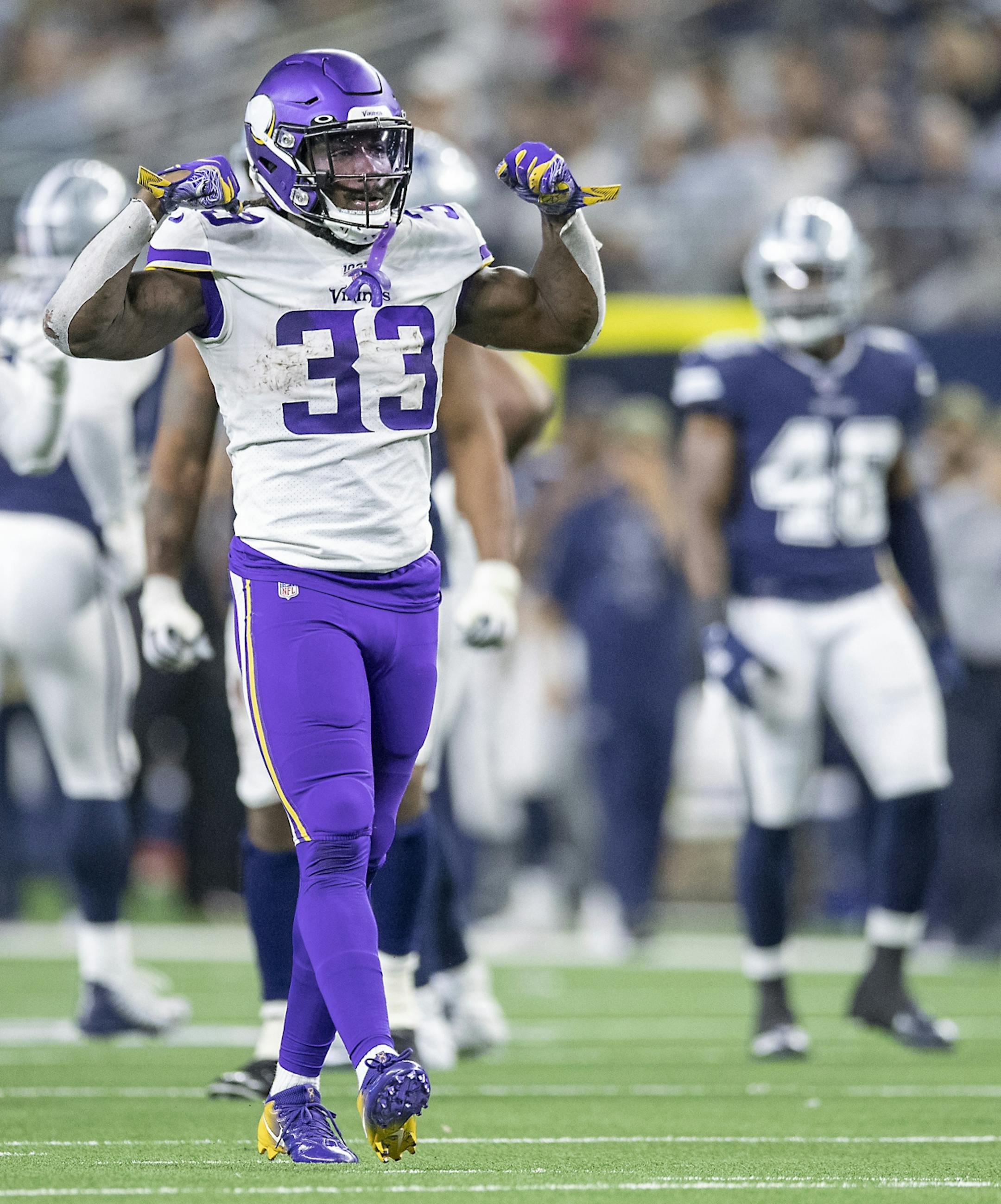 Minnesota Vikings' running back Dalvin Cook flexed after rushing for a first down in the third quarter.